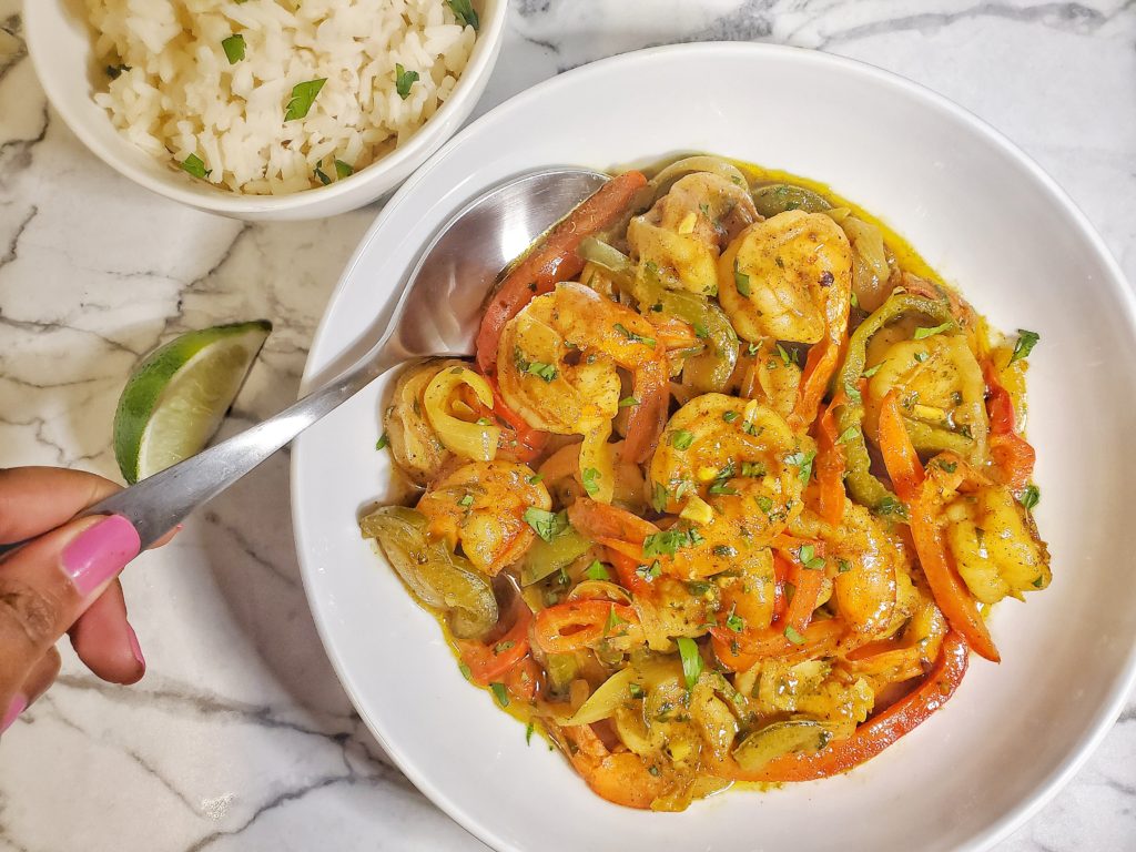 Coconut curry shrimp with peppers and onions and rice