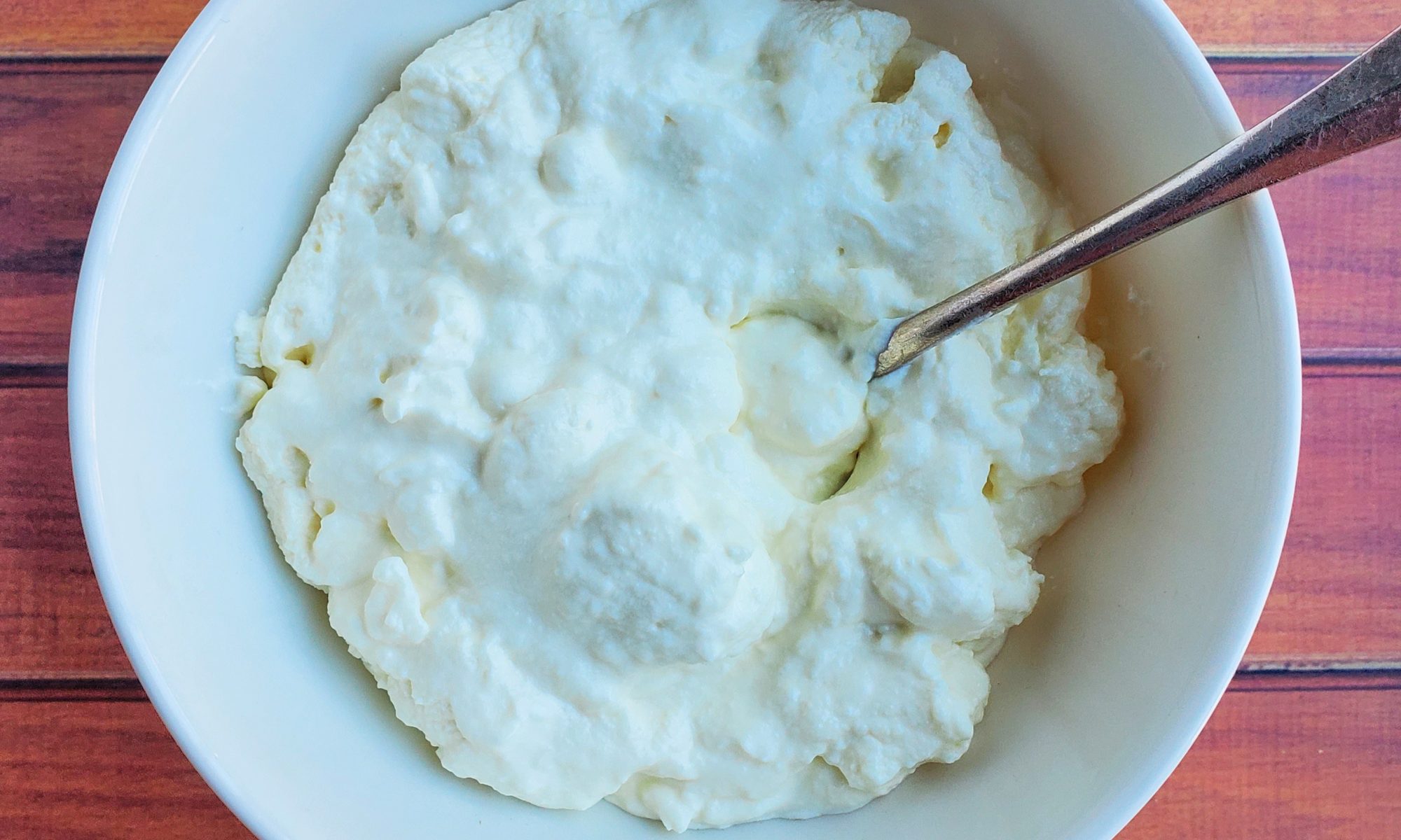 Homemade ricotta cheese in a bowl