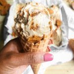 Scoop of cookie butter ice cream on a cone