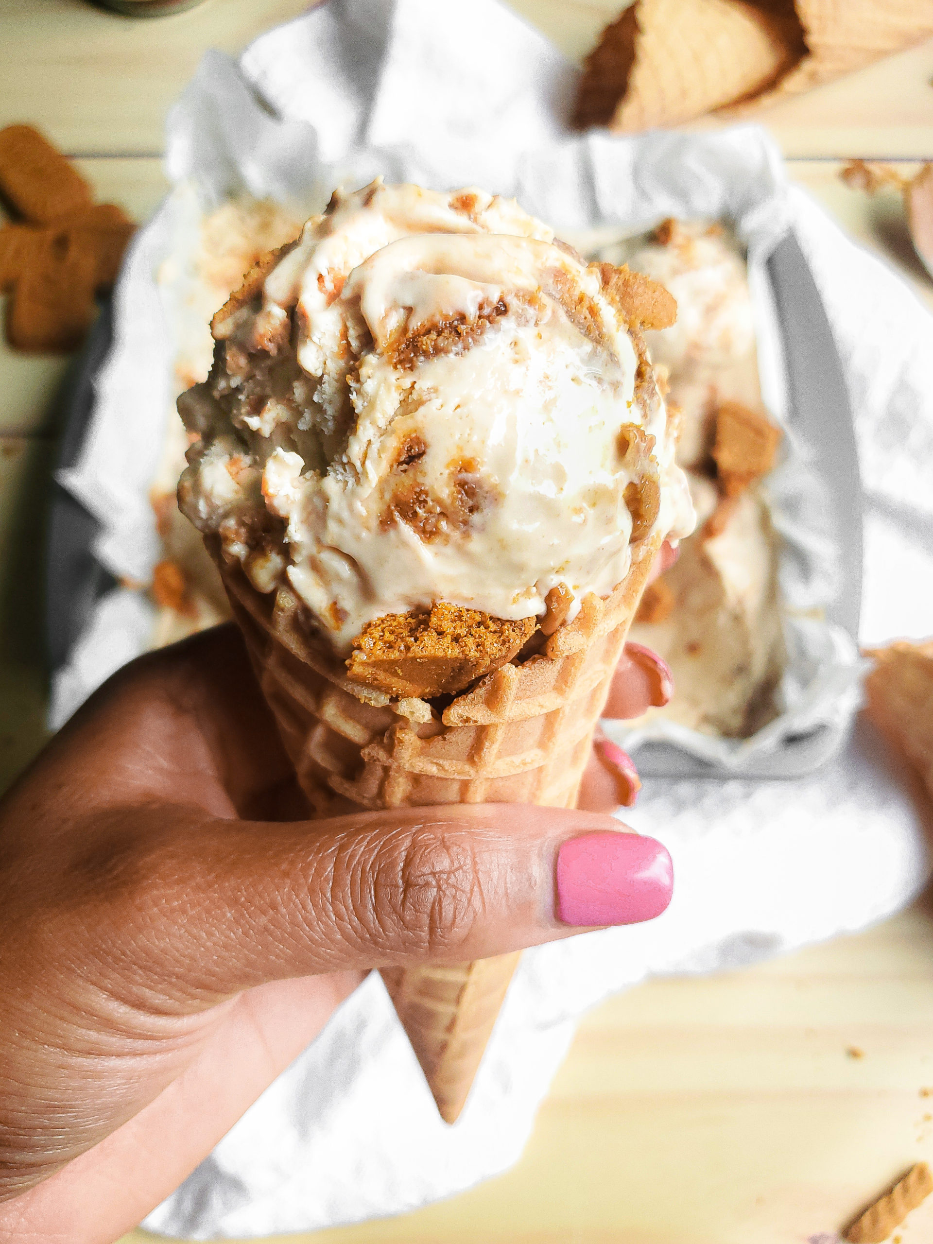 Scoop of no churn cookie butter ice cream on a cone