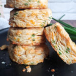 Cheddar scallion biscuits on a plate