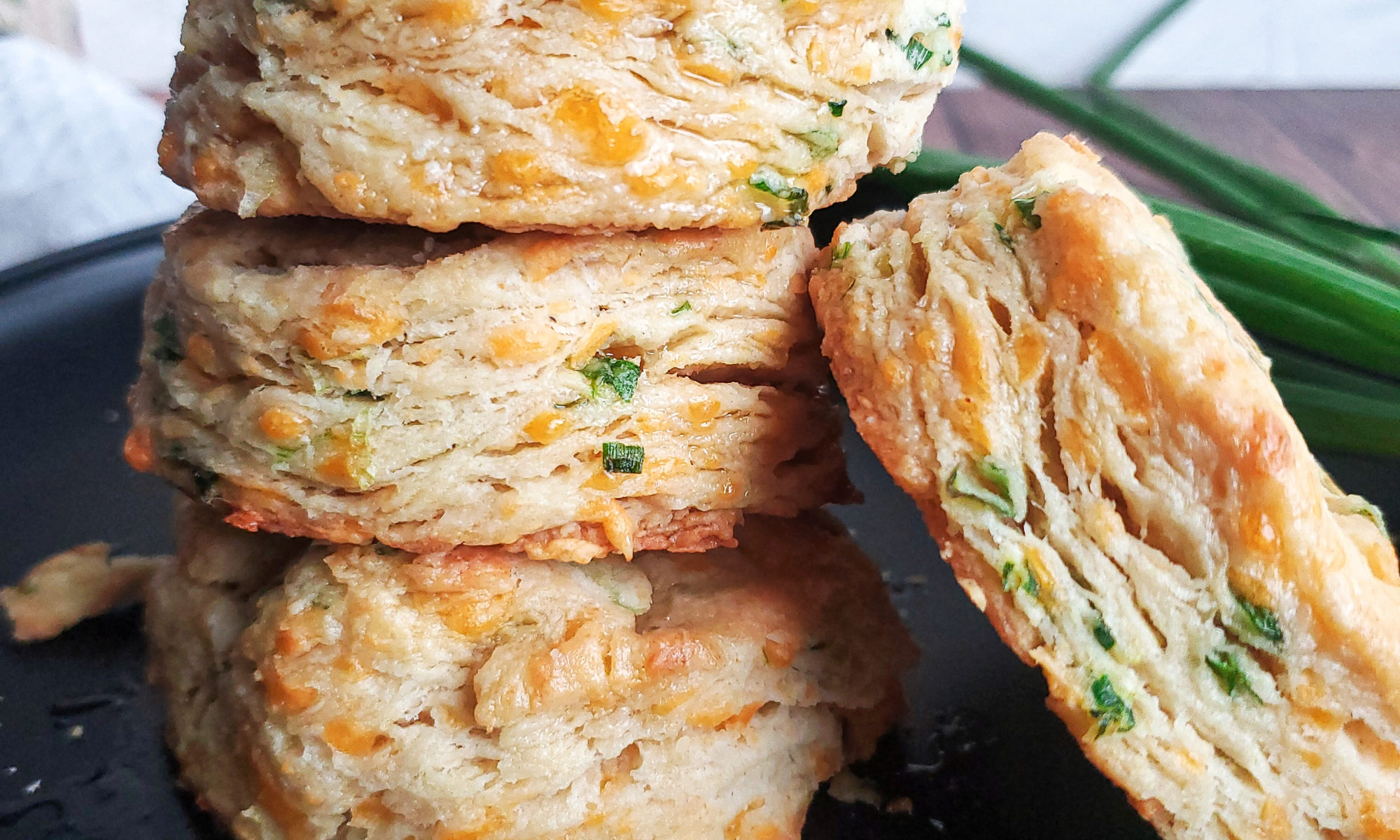 Cheddar scallion biscuits on a plate