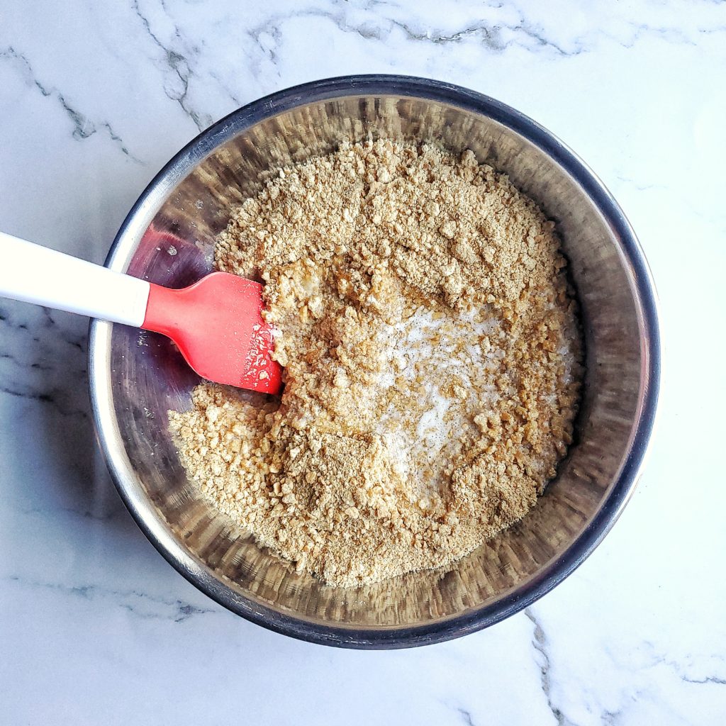 Overhead shot of graham cracker crust being mixed together