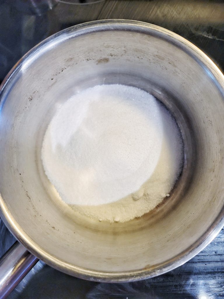 Sugar in a pot to make caramel sauce