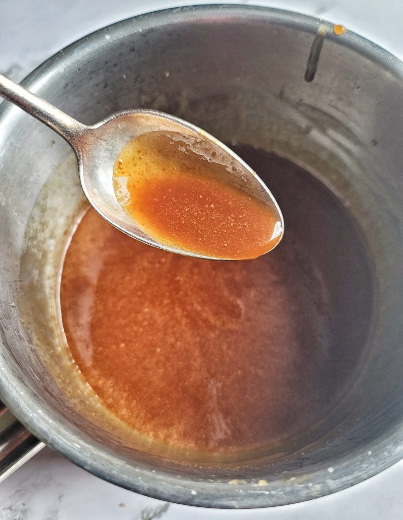 Spoonful of homemade caramel sauce 