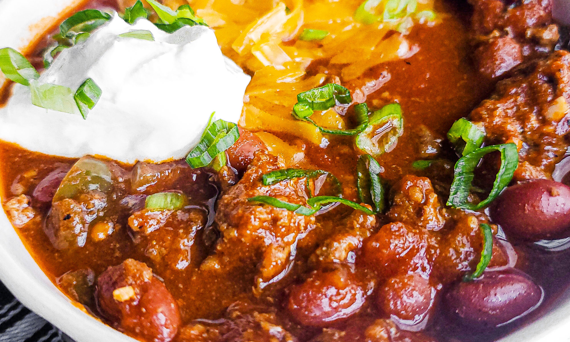 Close up shot of chili in a white bowl