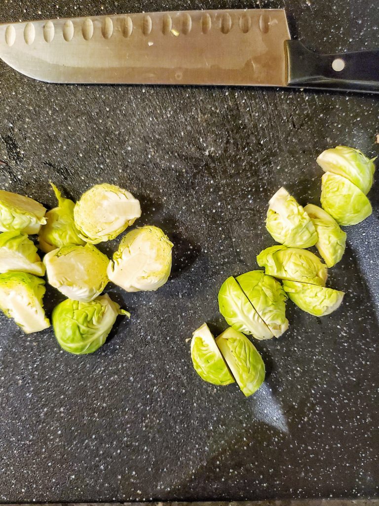 Brussels sprouts halves on a cutting board