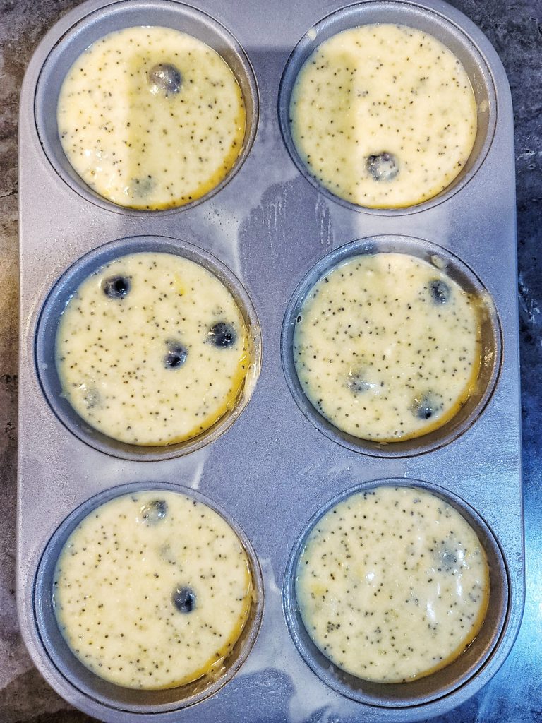 Portioned muffin batter in muffin tins