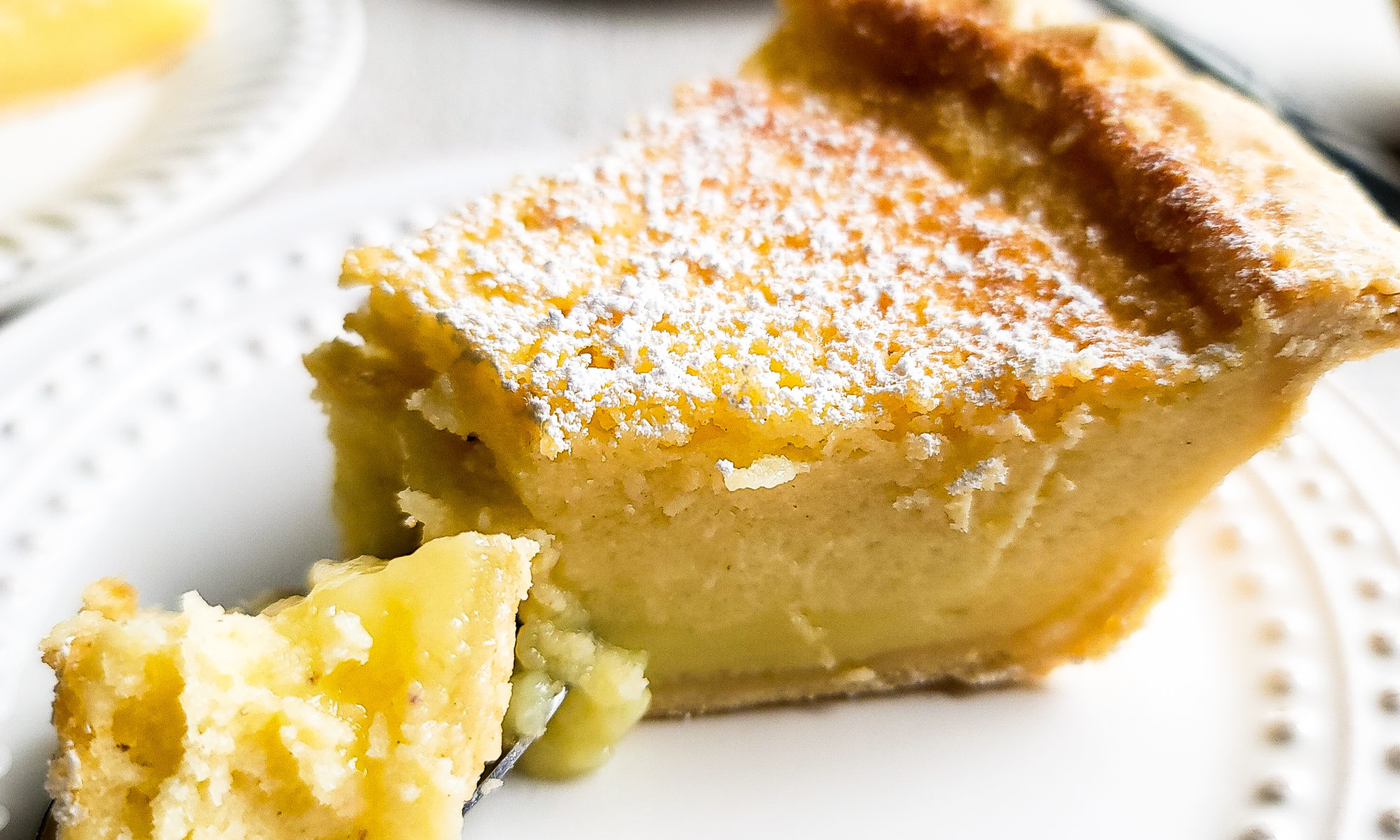 Close up shot of lemon buttermilk custard pie slice